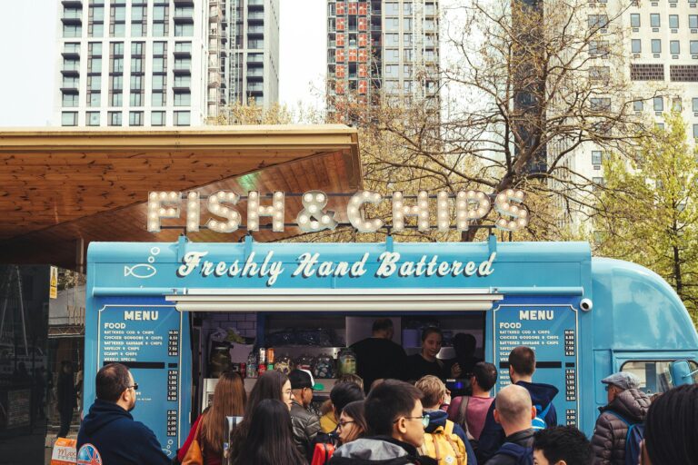 People eating at a food truck at an in-home event