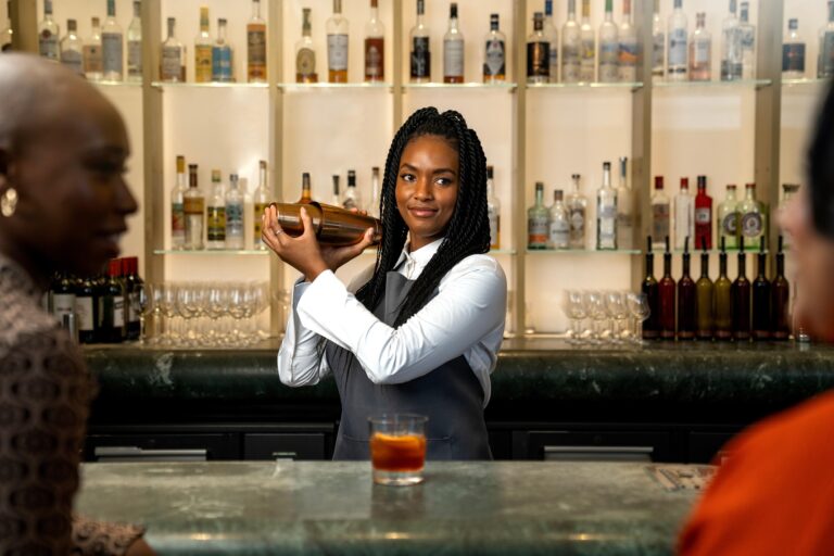 A bartender mixing a drink.